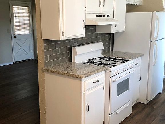 Kitchen with view into Living area from Dining area