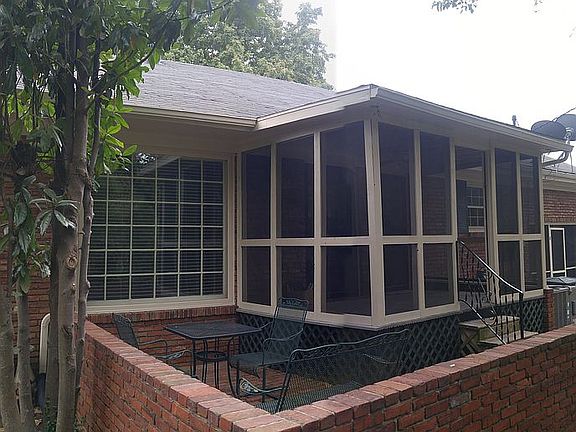 screen porch and brick patio