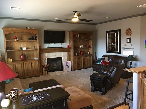 Large Family Room with "flip-of-the-switch" fireplace! Custom Builtins adorn each side!