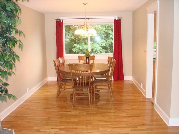 Large formal dining area overlooks private backyard
