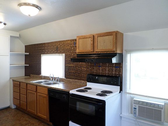 Well maintained kitchen with self cleaning oven, refrigerator and dishwasher . Kitchen is open concept to living room.