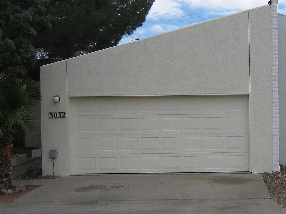 The front of the home with separate driveway, two car garage