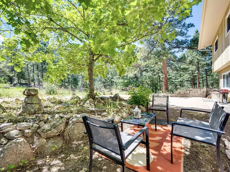 Garden level front private patio with rock garden, nestled in the rocky Mountains