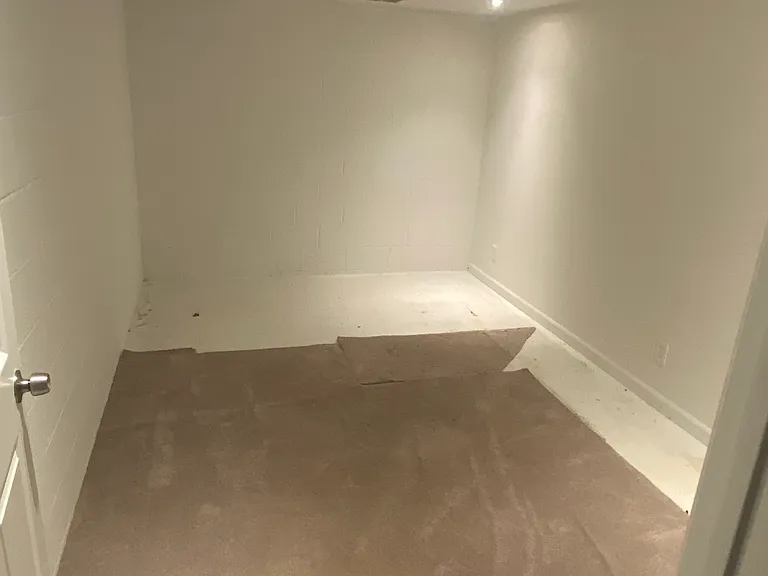 Finished storage space or break room in basement.