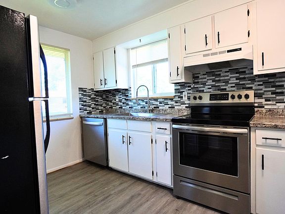New Countertops, new Sink, New Floor, Stainless steel stove, refrigerator, and dishwasher.