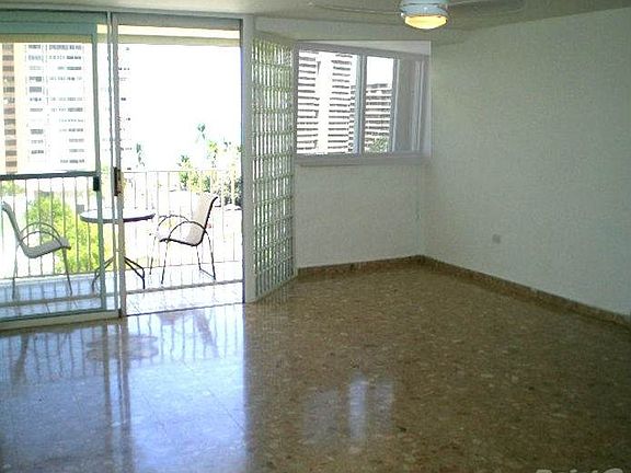 Spacious Living Room with North-facing balcony and lots of natural sunlight and cool breeze.