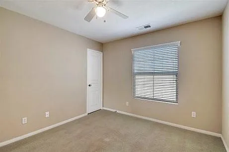Bedroom 2. Has been converted to hardwood flooring (not shown).