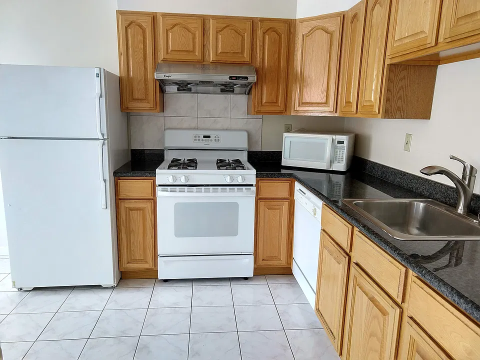 Kitchen with refrigerator, stove/oven, dishwasher, garbage disposal, granite countertops