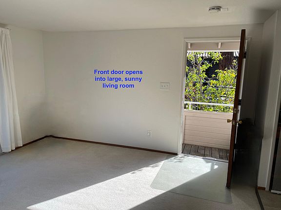 This picture shows carpeting- it is being replaced with beautiful brand new wood laminate flooring