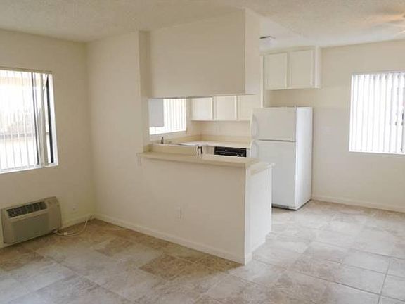 Dining Room (stock photos of a similar unit; available unit does not have tile throughout)