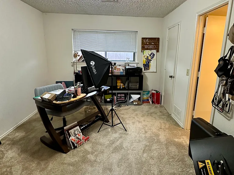 Bedroom featuring carpeted floors, could be used as optional office space.