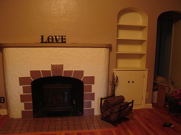 Original Fireplace, bookcases/shelves on both sides