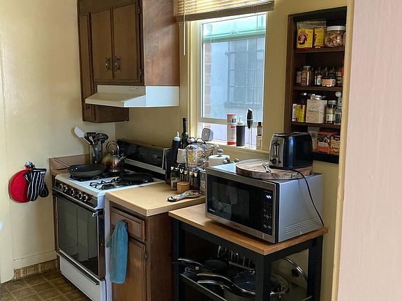 Kitchen before remodel - we will paint, replace stove and install new flooring