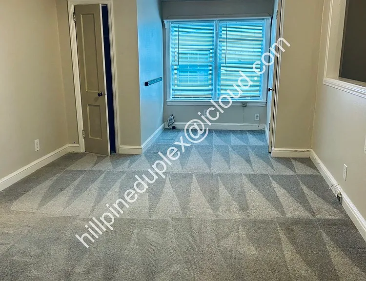 Living room with numerous closets