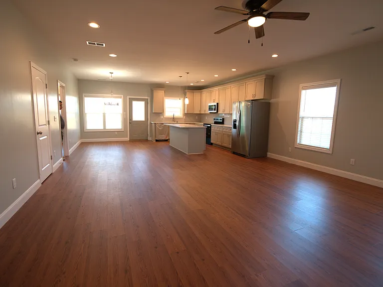 Living room looking into kitchen and dinning areas
