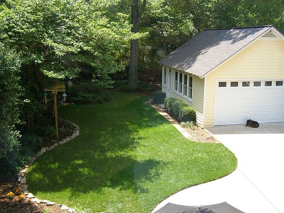 Deep lot with mature oaks, custom garage shop with windows, 200A service