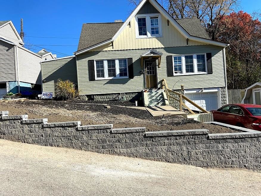 Apartment is left half of house with a rear entrance and rear parking pad