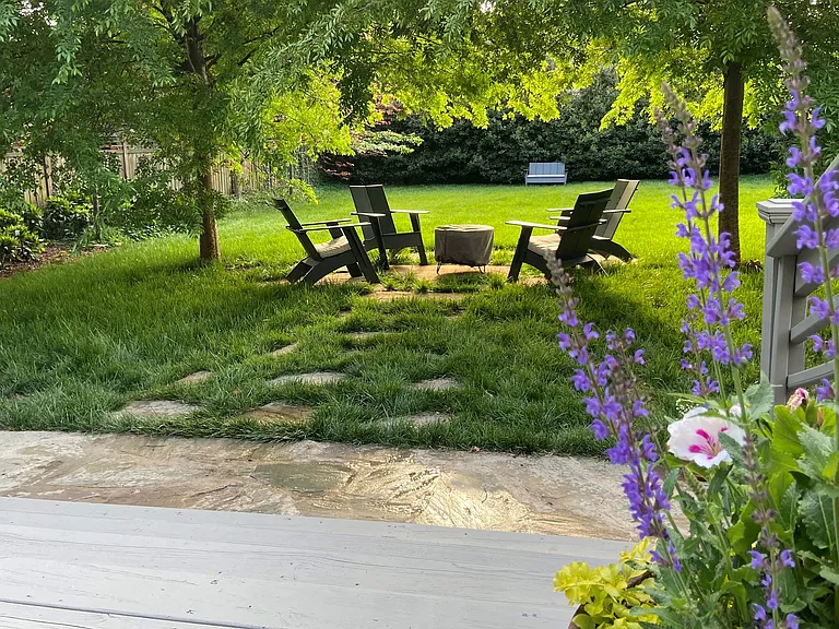 Back yard with fire pit area featuring Room and Board furnishings