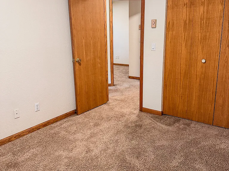 Private third bedroom offering comfortable living space and ample natural light.