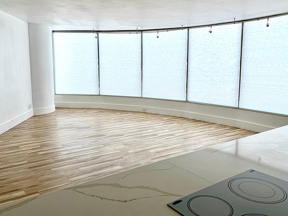Living room with window coverings lowered.