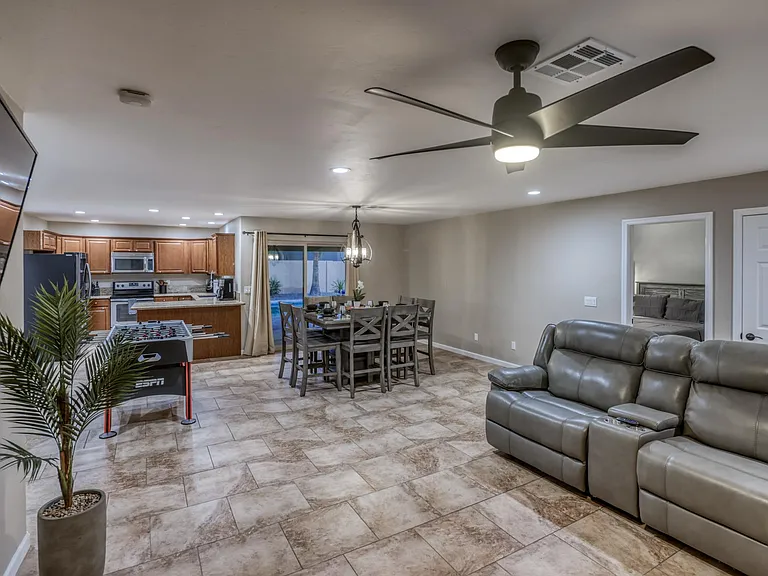 Granite countertops, stainless appliances, and ample cabinetry complete this upgraded kitchen.