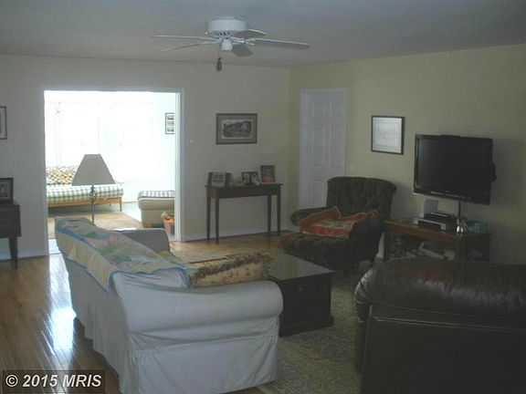 Great room is open to gourmet kitchen and sunroom