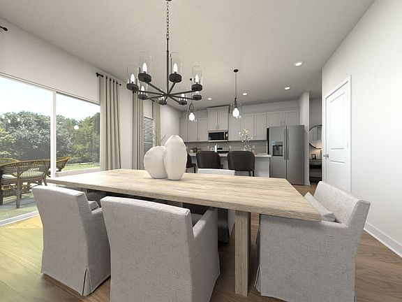 The open floorplan creates a seamless flow between the kitchen and dining areas.