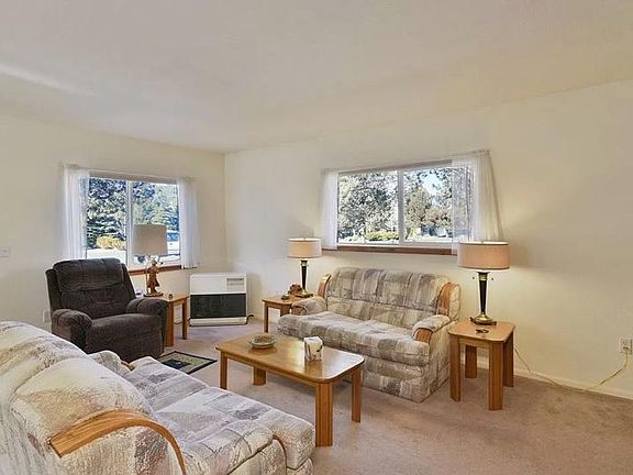 Living room with Monitor Heater. One of these Couches, TV & stand & lamps are available if you desire furnishings.