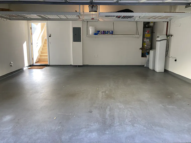2-car side-by-side finished garage. Storage racks in the garage.