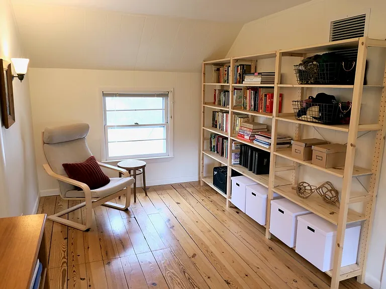 Open area between two bedrooms, one on the left and one on the right.