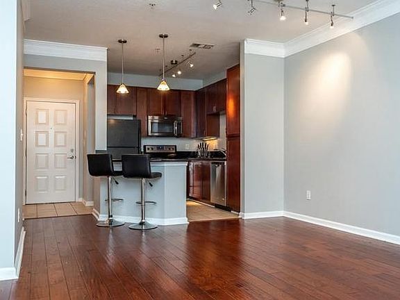 Newer hardwood floors in spacious living room.