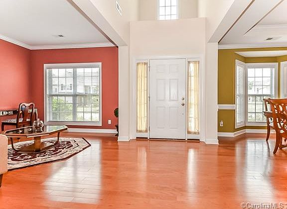2-Story, center hall foyer flanked by formal rooms.