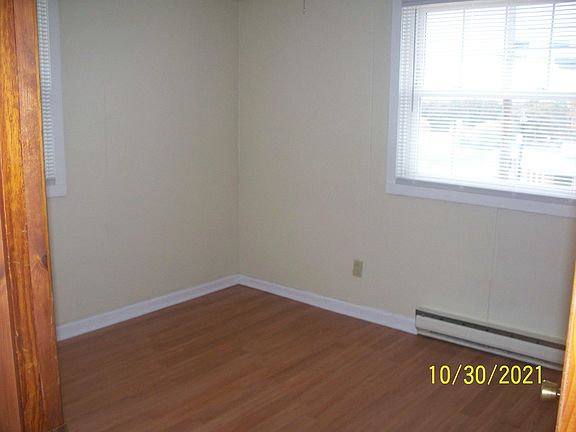 First bedroom (12 x 11) +closet. Picture taken from doorway looking left. Notice two windows. Closet to the right.