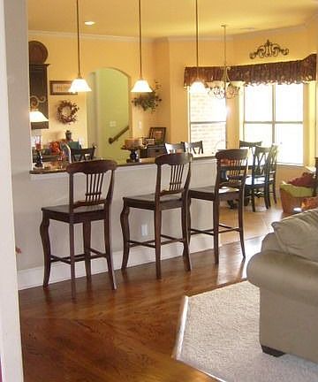 awesome real wood flooring and custom lighting everywhere