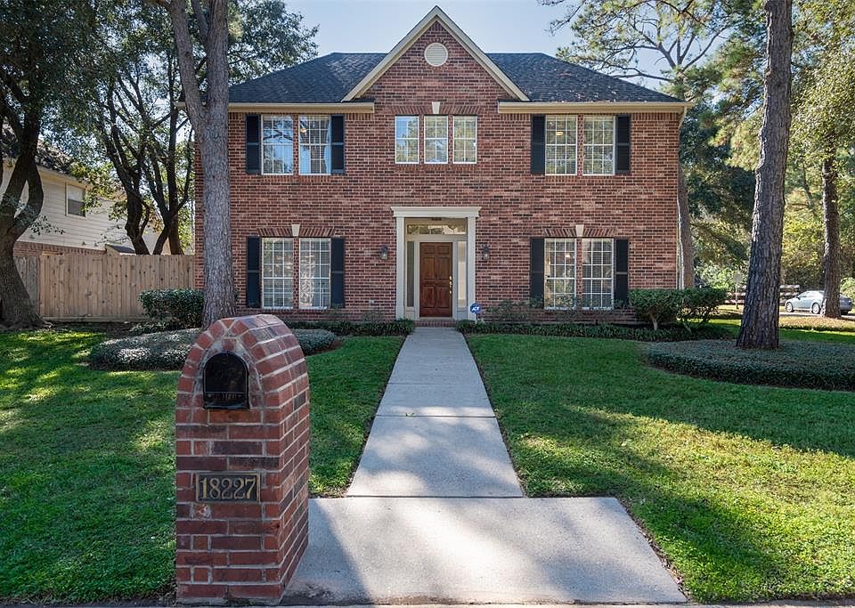 Welcome to 18227 Fernbluff. The curb appeal is inviting and it's even more elegant on the interior.