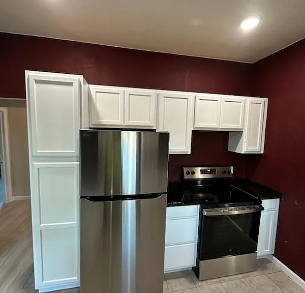 Left side of the kichen. On the left is hall to the back door. New appliances in the kitchen.