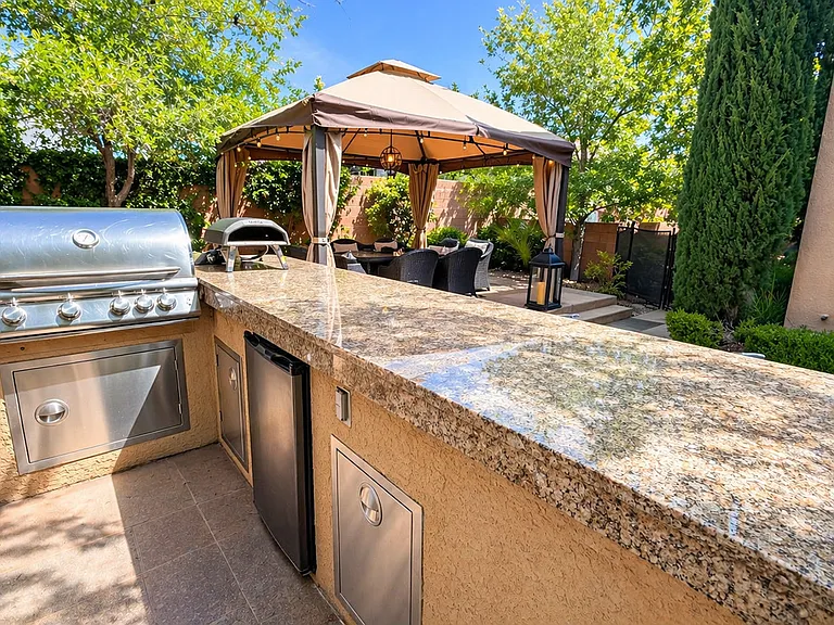 Built in BBQ grill with intergrated fridge, trash bin and storage