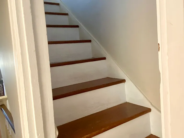 2nd floor staircase up to finished loft, bonus work/living space.