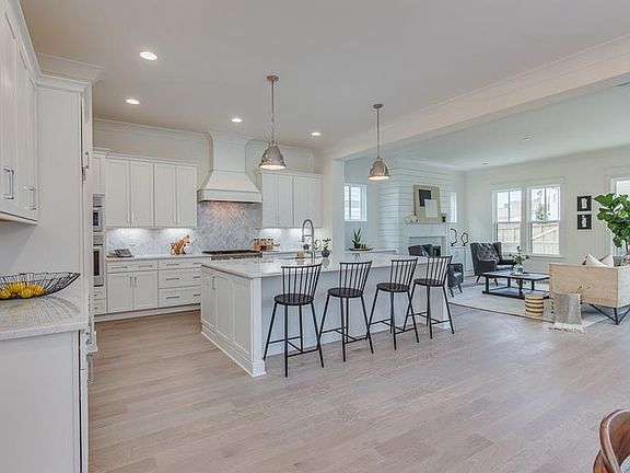 This is a photo of a completed version of the same exact floor plan and the same designer finishes - representative only.