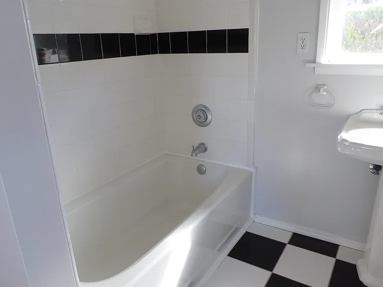single bathroom with double shower head, sink, toilette
