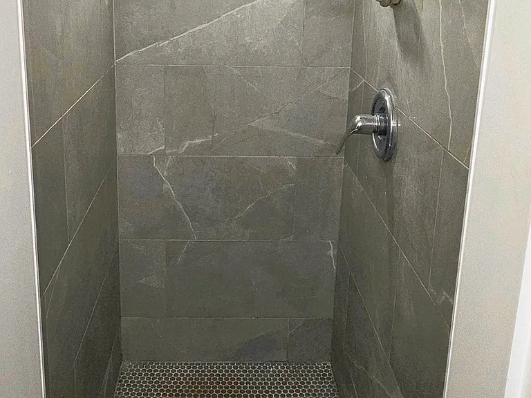 Stylish tiled shower with modern finishes.