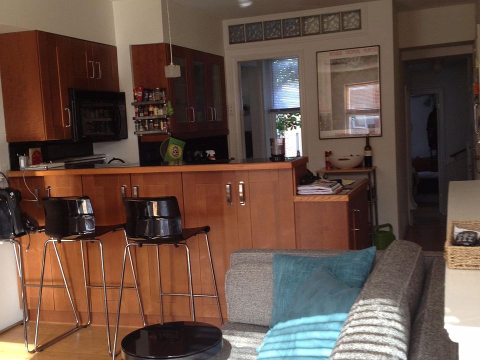 View living room to kitchen to bath