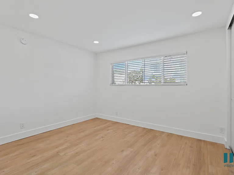 Bedroom with Vinyl Flooring, Recessed Lighting, and Window