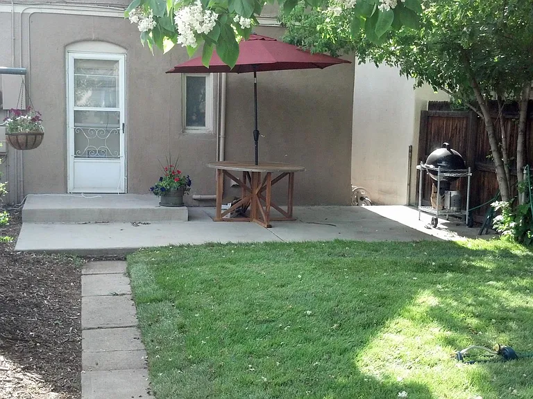 Patio for relaxing under mature trees.

BBQ grill includec