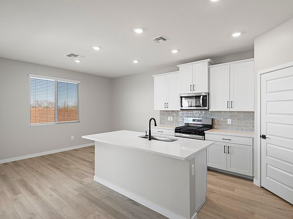 The kitchen overlooks the breakfast nook.