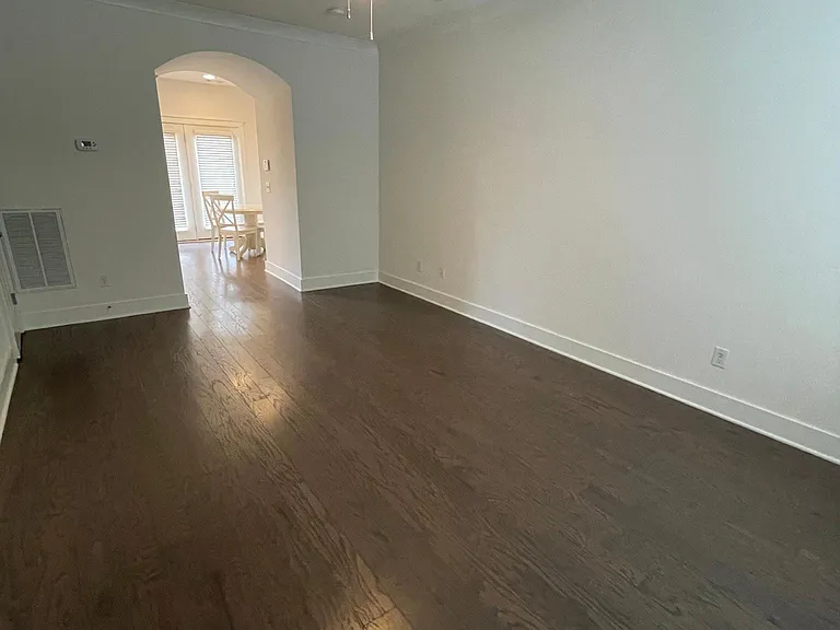 View from the front door of the roomy living room, looking into the kitchen