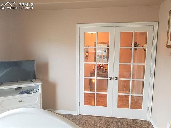 Main floor bedroom or office has french doors. This room is next to the main bathroom that is handicap accessible.