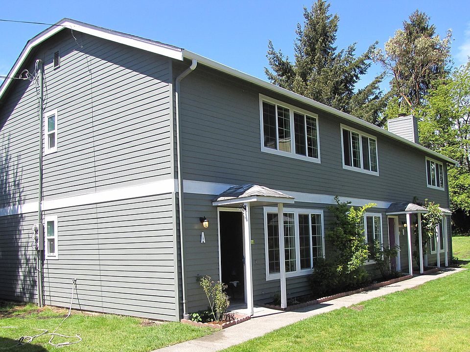 Triplex with adjacent carport