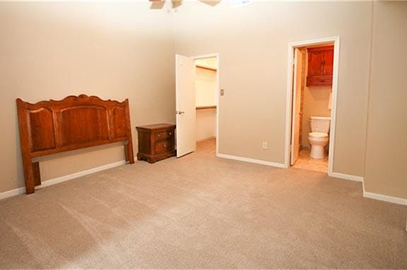 Bedroom 1 features and a large closet and private bathroom