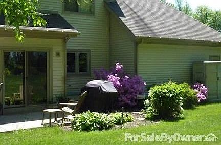 Walk out your kitchen for grilling and eating under the umbrella.